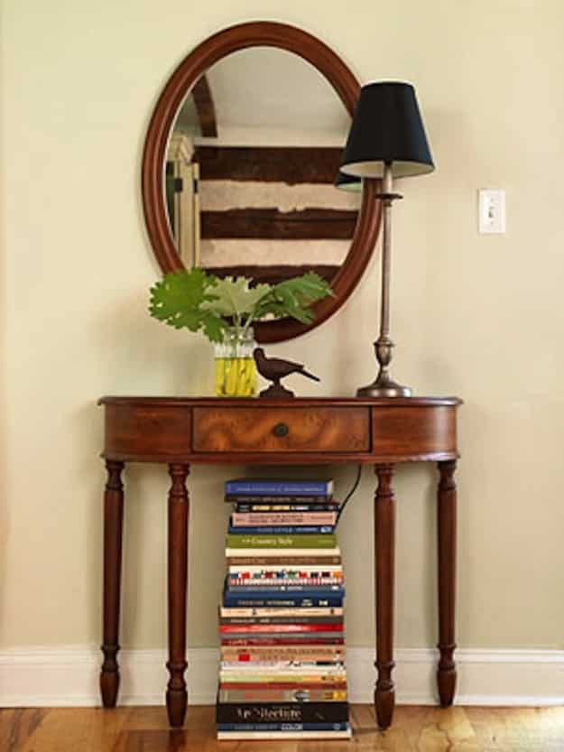 Use an artful stack of books to hide unsightly things like cords or your router.