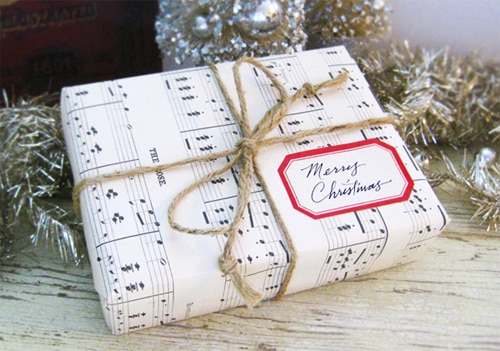Store-bought wrapping paper is a social construct! Use something more fun, like sheet music: 