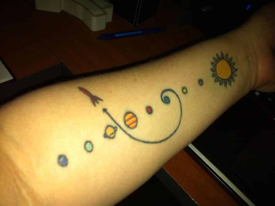 Space themed arm tattoo design