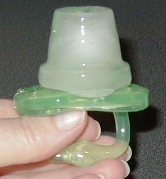 Freeze a pacifier in an ice cube tray with juice, milk, formula, or water to sooth a teething baby's gums.