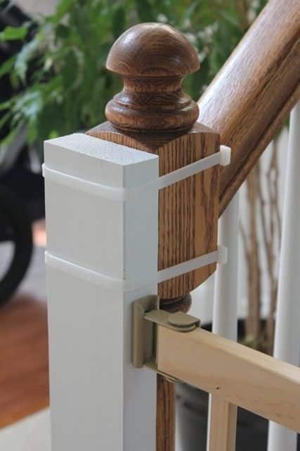 Install a baby-gate using heavy-duty cable ties instead of nailing into the banister.