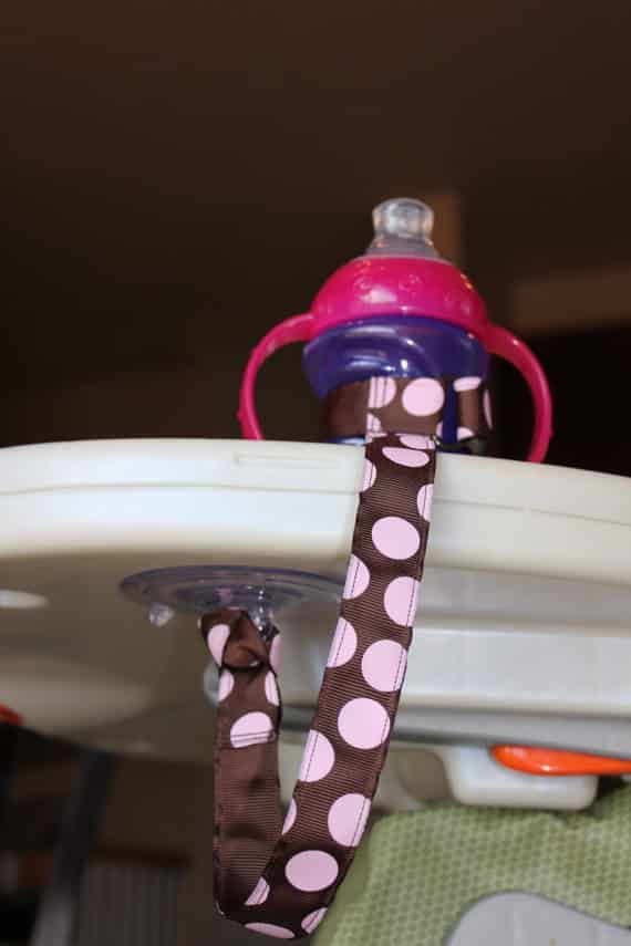 This sippy-cup leash keeps it from tumbling to the ground.