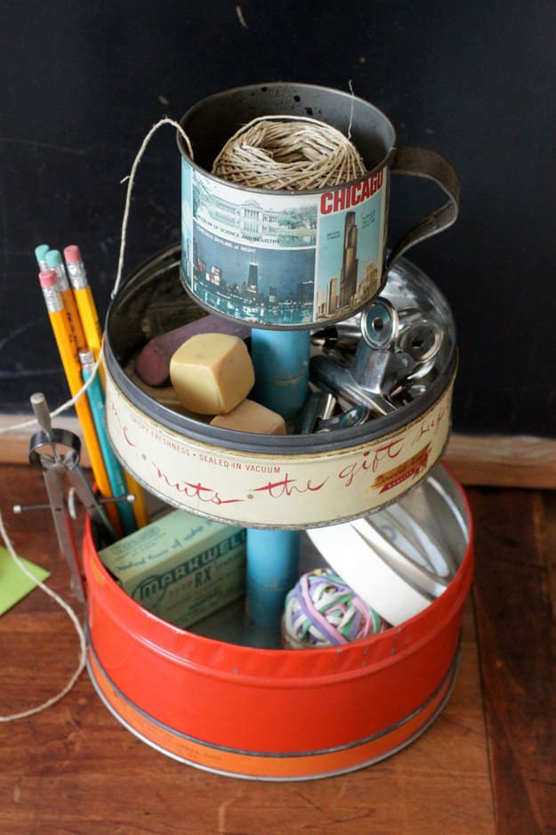 Want to make your vintage tin collection a little bit more useful? Turn a few of them into a desk organizer.