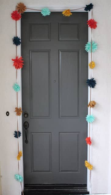Hang a colorful garland around your door.