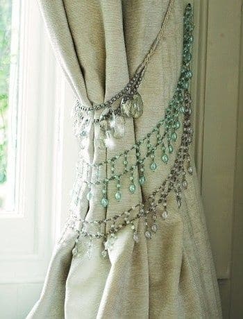 Repurpose your old rhinestone necklaces to make curtain tiebacks for a bohemian-inspired home.