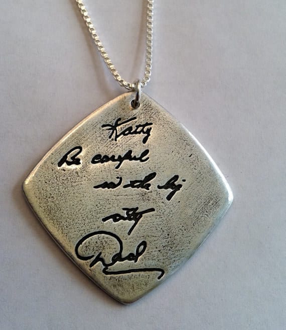 A pendant with an engraved message in a loved one&#39;s handwriting.