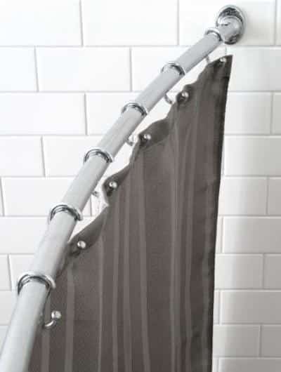 Use a curved shower rod for a bigger feeling shower.