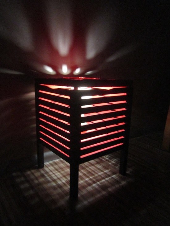 Add a lamp to the inside of a Moleg storage stool and turn it into a nightlight / nightstand combo.