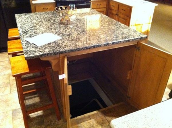 Hide the entrance to a secret fallout shelter, wine cellar, or basement in your kitchen island.