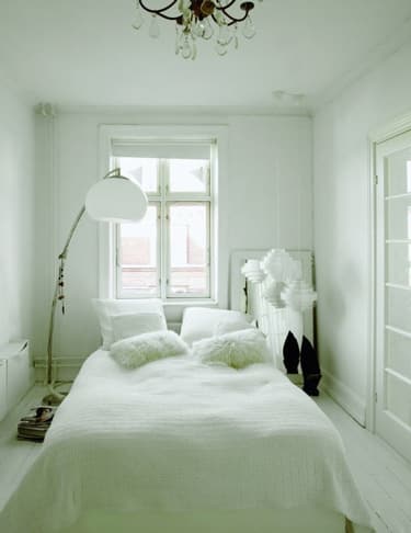 You can skip the headboard in favor of a few inches of more floorspace.