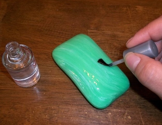 Paint a bar of soap with nail polish and leave it in the shower.