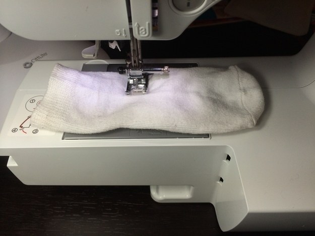 Sew one of your kidâ€™s socks closed halfway down.