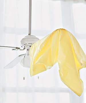5. Dust off your fan blades with a pillowcase.