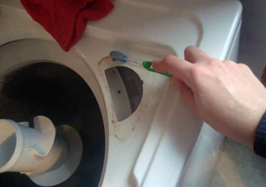 29. Clean out a top loading washing machine with vinegar, baking soda, and an old toothbrush.