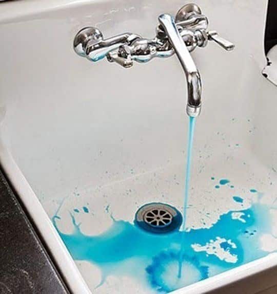 Put a few dye pellets under the cap of your faucet.