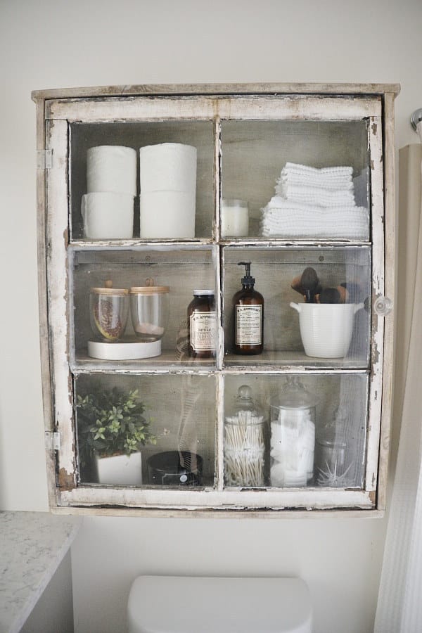 Turn a reclaimed window into a medicine cabinet.
