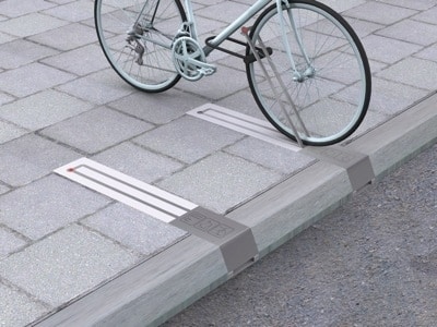 This unobtrusive bike rack takes up no space when there isn&#39;t a bike pinned to it.