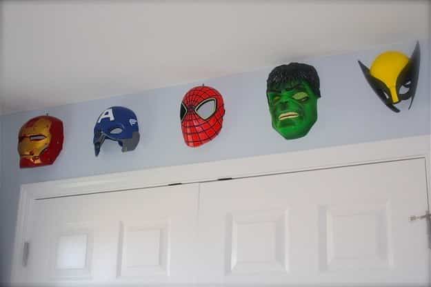 Use Halloween masks to make great, low-cost wall hangings.