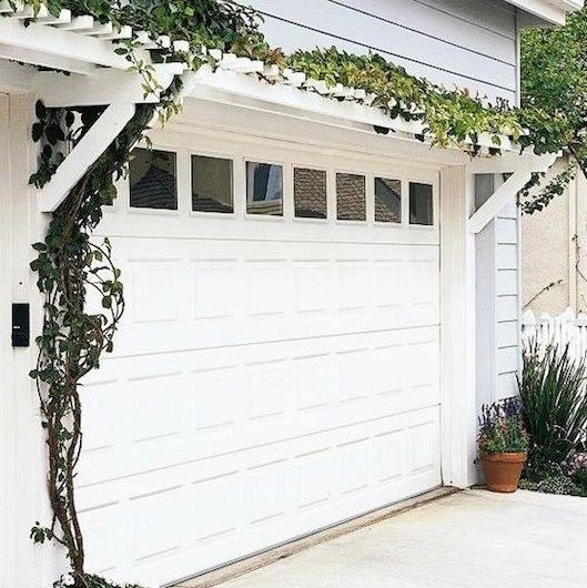 Take it up a notch and add a pergola with climbing vines.