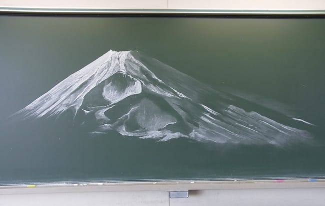 On the other end of the spectrum, though no less nuanced, is this minimalist approach to Mt. Fuji, created by two students from the Miko Sakuranomaki High School in the Ibaraki Prefecture. Using just white chalk, they managed to capture the iconic, snow-covered slopes of Japan's famous mountain.
