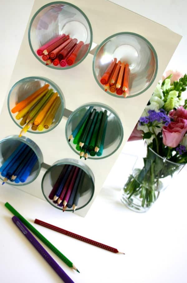 Place cups in a wine rack and use them to store pens and pencils.
