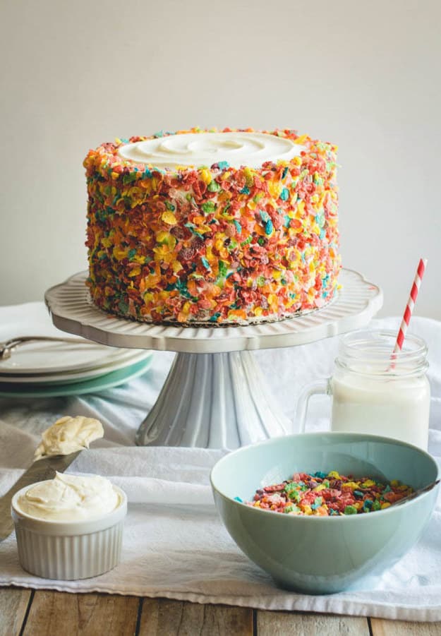 Prepare a cake that combines breakfast with dessert and use Fruity Pebbles as a topping.