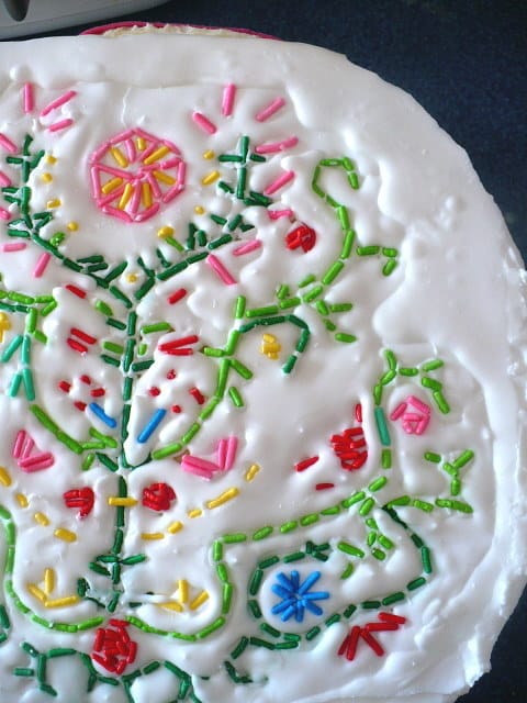 "Embroider" a cake with sprinkles.