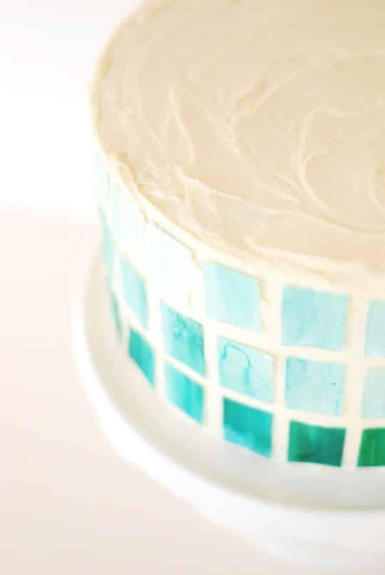 Easily create a gorgeous ombre cake using edible decorating paper and food dye.