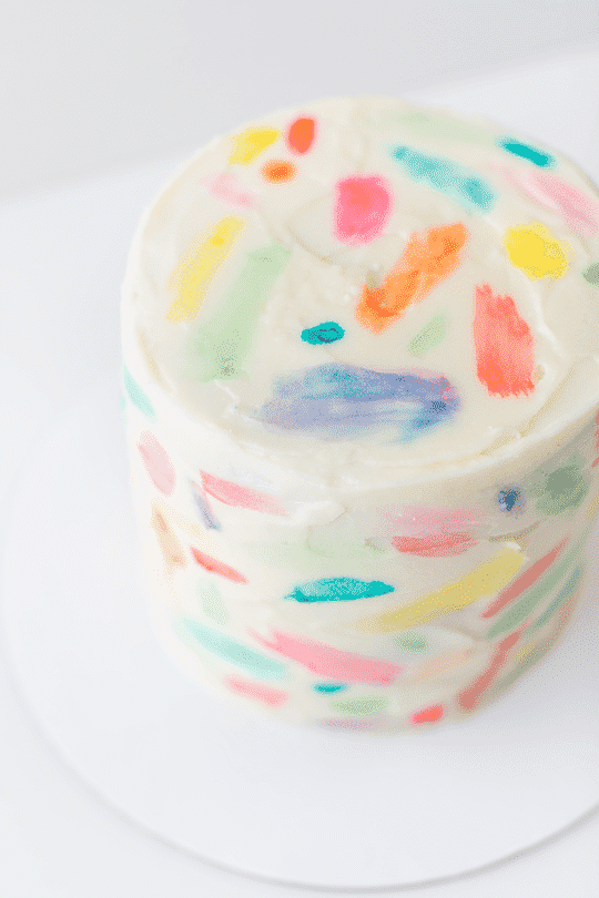 Create a "watercolored" cake using gel food coloring and a paintbrush.
