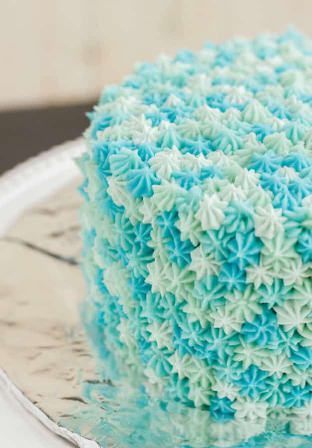 Make some buttercream frosting in a variety of colors and use a decorating tip to completely cover a cake with stars.