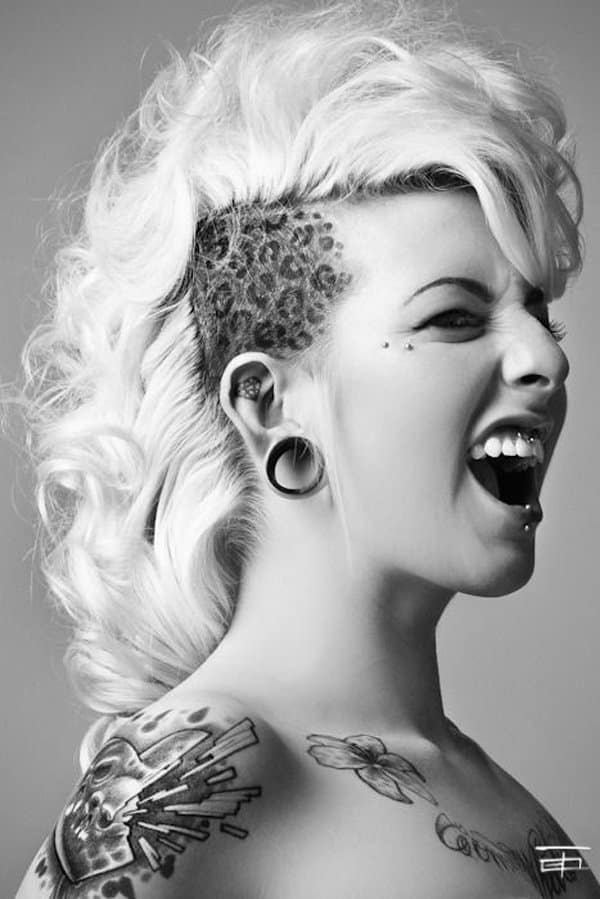 Cheerful female with tattoos in eye patches · Free Stock Photo