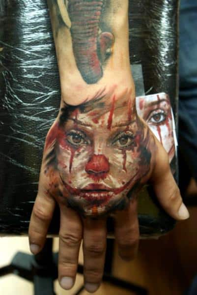 Clown Hand Tattoo by Bloodlines Gallery