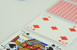 assorted playing cards on white surface