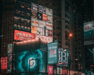 Free Building wrap screens in downtown at night Stock Photo